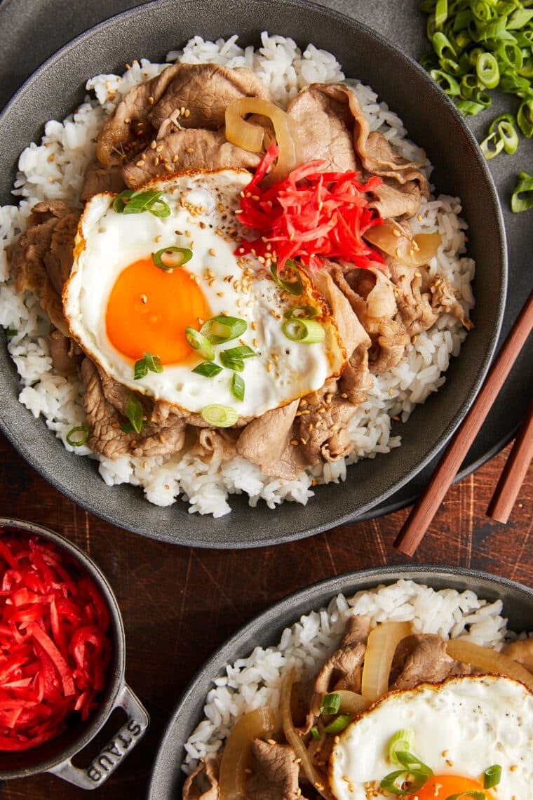 Gyudon (Japanese Beef Rice Bowl) - A weeknight favorite with thinly sliced beef + tender onions in a sweet and savory sauce! So quick + easy!