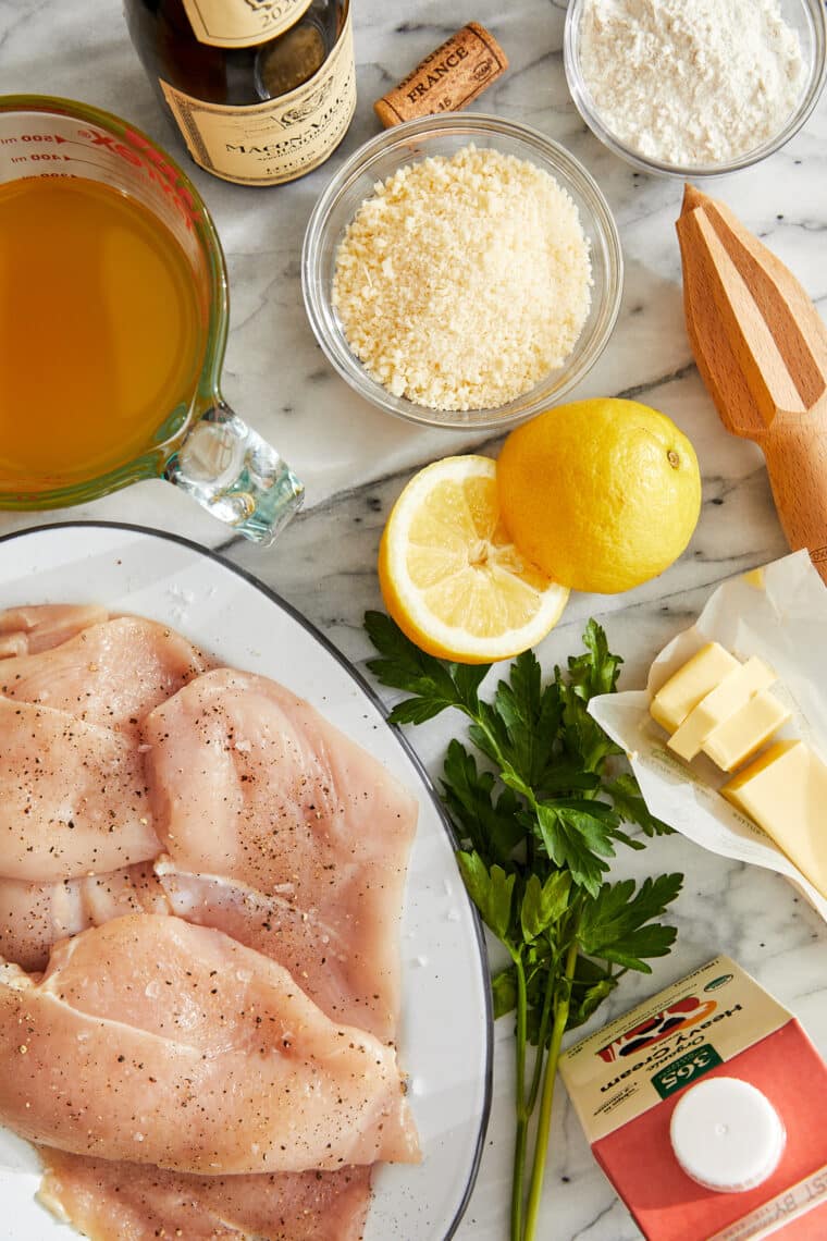 Parmesan Lemon Chicken - Golden brown, juicy, tender, parmesan-crusted chicken breasts in a creamy, lemon-garlicky sauce made in 30 minutes!