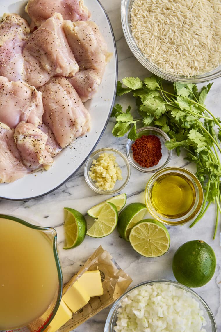 One Pan Cilantro Lime Chicken and Rice - Perfectly seasoned, juicy chicken with the fluffiest cilantro lime rice, all made in one pot. YES!