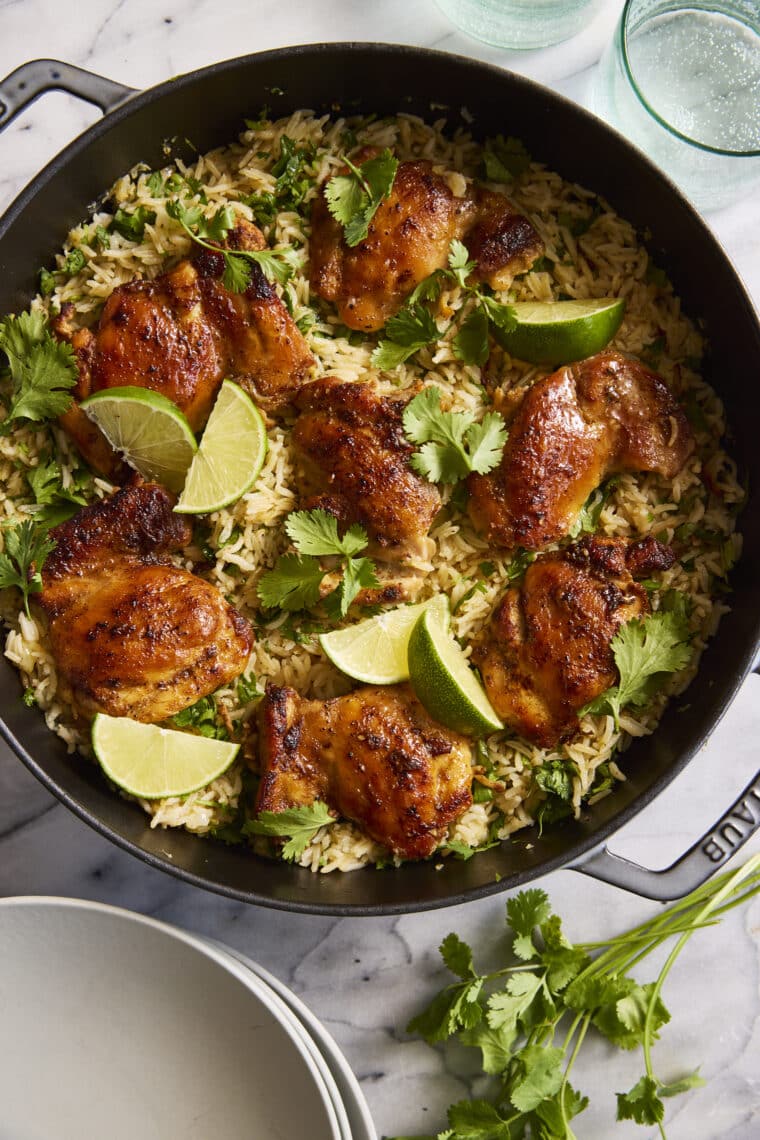 One Pan Cilantro Lime Chicken and Rice - Perfectly seasoned, juicy chicken with the fluffiest cilantro lime rice, all made in one pot. YES!