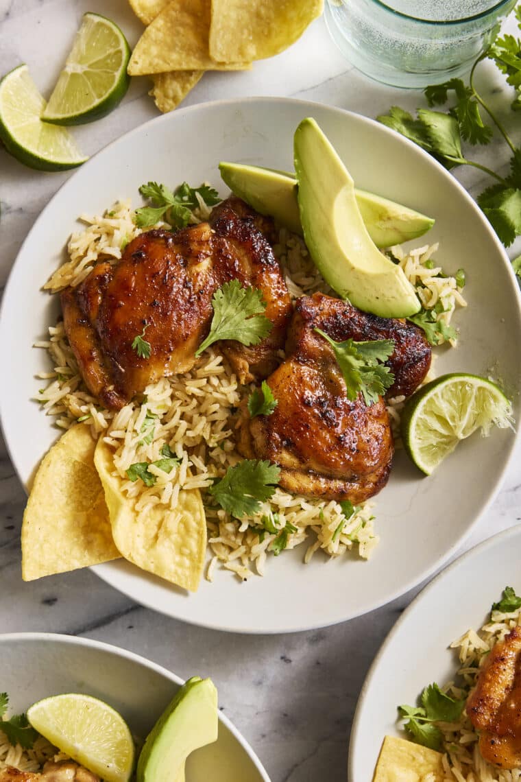 One Pan Cilantro Lime Chicken and Rice - Perfectly seasoned, juicy chicken with the fluffiest cilantro lime rice, all made in one pot. YES!