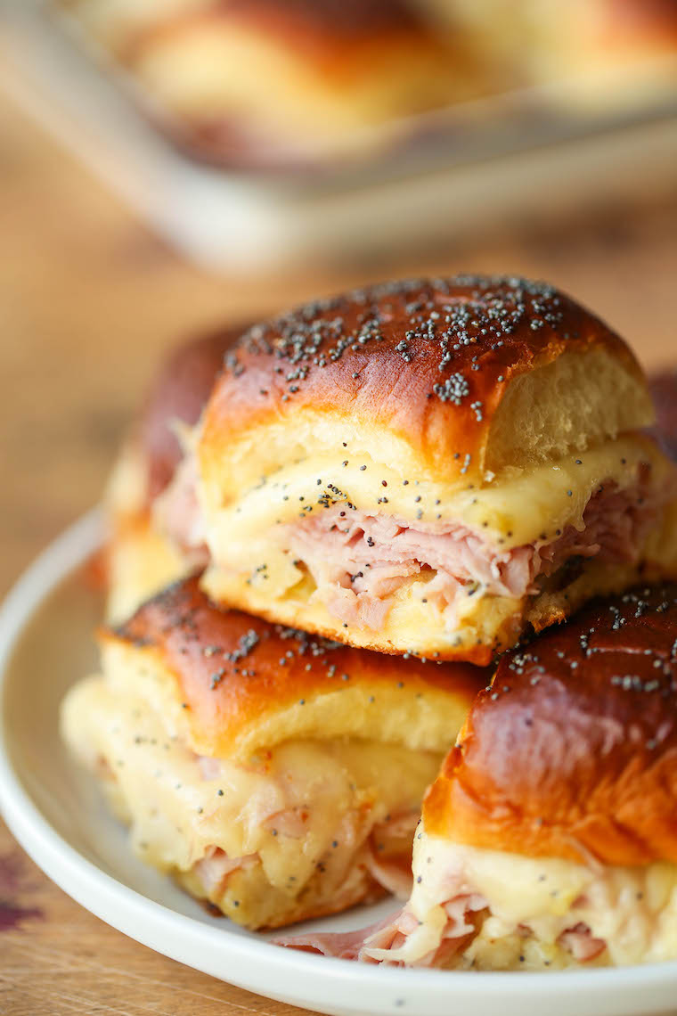 Ham and Swiss Sliders - Ham, Swiss cheese, Dijon, and oh-so-buttery Hawaiian rolls, all baked to absolute perfection. So easy and perfect for a big crowd!
